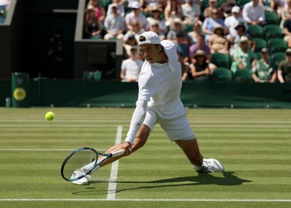 3rd July 2025; All England Lawn Tennis and Croquet Club, London, England; Wimbledon Tennis Tournament, Day 4; Arthur Cazaux (FRA) with a backhand shot to Alex de Minaur (AUS)  ActionPlus12808111 JohnxPatrickxFletcher
