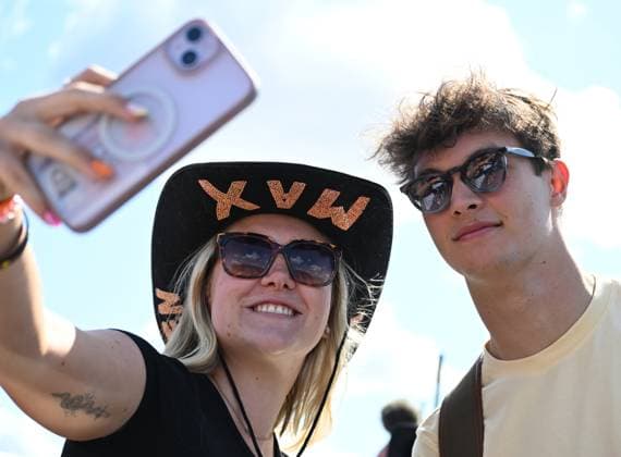 3rd July 2025; Silverstone Circuit, Northamptonshire, England; Formula 1 2025 Qatar Airways British F1 Grand Prix; Arrivals and Inspection Day; Oliver Bearman of Haas poses for photos with fans on arrival at Silverstone  ActionPlus12808241 SimonxWest