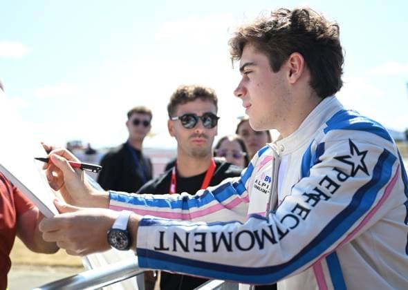 3rd July 2025; Silverstone Circuit, Northamptonshire, England; Formula 1 2025 Qatar Airways British F1 Grand Prix; Arrivals and Inspection Day; Franco Colapinto of Alpine signs autographs on arrival at Silverstone  ActionPlus12808231 SimonxWest