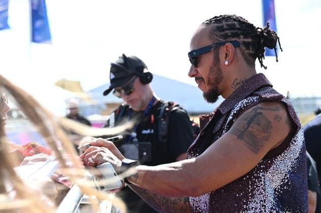 3rd July 2025; Silverstone Circuit, Northamptonshire, England; Formula 1 2025 Qatar Airways British F1 Grand Prix; Arrivals and Inspection Day; Lewis Hamilton of Ferrari signs autographs on arrival at Silverstone  ActionPlus12808235 SimonxWest