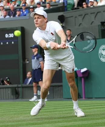 Italian Jannik Sinner plays a backhand in his second round match against Australia s Aleksandar Vukic on day four of the 2025 Wimbledon Championships in London on Thursday, June 03, 2025.  LON2025070365 HUGOxPHILPOTT