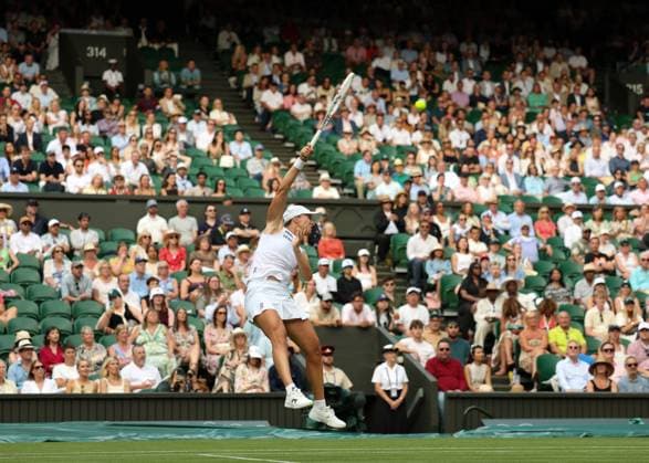 3rd July 2025; All England Lawn Tennis and Croquet Club, London, England; Wimbledon Tennis Tournament, Day 4; Iga Swiatek (POL) with a forehand shot to Caty McNally (USA)  ActionPlus12808511 JohnxPatrickxFletcher