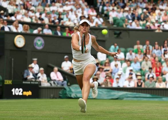 3rd July 2025; All England Lawn Tennis and Croquet Club, London, England; Wimbledon Tennis Tournament, Day 4; Caty McNally (USA) with a forehand shot to Iga Swiatek (POL)  ActionPlus12808512 JohnxPatrickxFletcher