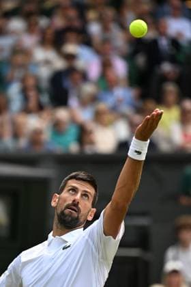 (250704) -- LONDON, July 4, 2025 -- Novak Djokovic serves during the men s singles second round match between Novak Djokovic of Serbia and Daniel Evans of Britain at the Wimbledon Tennis Championships in London, Britain, July 3, 2025. ) (SP)BRITAIN-LONDON-TENNIS-WIMBLEDON-MEN S SINGLES ZhaoxDingzhe 