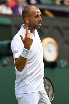 (250704) -- LONDON, July 4, 2025 -- Daniel Evans reacts during the men s singles second round match between Novak Djokovic of Serbia and Daniel Evans of Britain at the Wimbledon Tennis Championships in London, Britain, July 3, 2025. ) (SP)BRITAIN-LONDON-TENNIS-WIMBLEDON-MEN S SINGLES ZhaoxDingzhe 