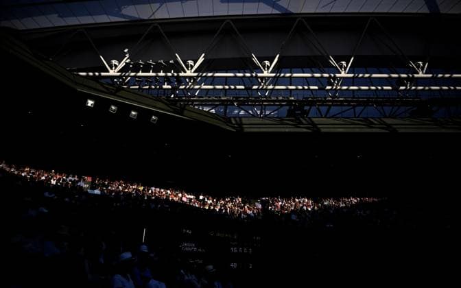 (250704) -- LONDON, July 4, 2025 -- Spectators watch the men s singles second round match between Jannik Sinner of Italy and Aleksandar Vukic of Australia at the Wimbledon Tennis Championships in London, Britain, July 3, 2025. ) (SP)BRITAIN-LONDON-TENNIS-WIMBLEDON-MEN S SINGLES LixYing 