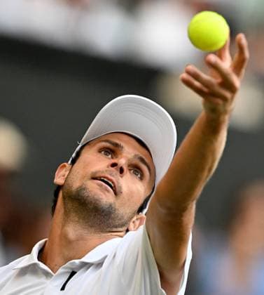 (250704) -- LONDON, July 4, 2025 -- Aleksandar Vukic serves during the men s singles second round match between Jannik Sinner of Italy and Aleksandar Vukic of Australia at the Wimbledon Tennis Championships in London, Britain, July 3, 2025. ) (SP)BRITAIN-LONDON-TENNIS-WIMBLEDON-MEN S SINGLES LixYing 