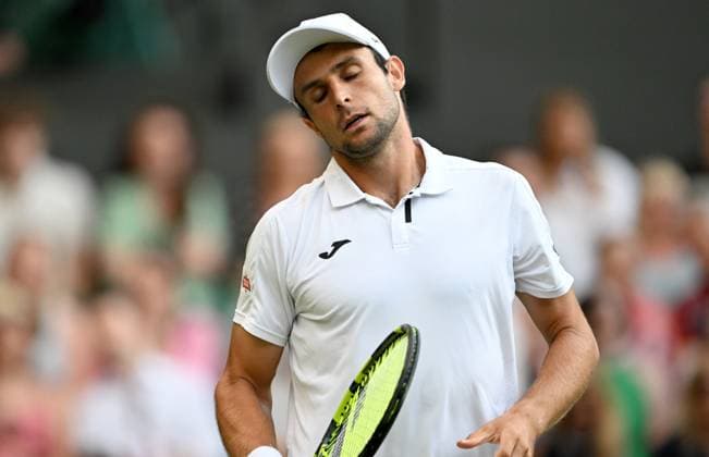 (250704) -- LONDON, July 4, 2025 -- Aleksandar Vukic reacts during the men s singles second round match between Jannik Sinner of Italy and Aleksandar Vukic of Australia at the Wimbledon Tennis Championships in London, Britain, July 3, 2025. ) (SP)BRITAIN-LONDON-TENNIS-WIMBLEDON-MEN S SINGLES LixYing 