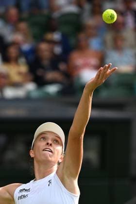 (250704) -- LONDON, July 4, 2025 -- Iga Swiatek serves during the women s singles second round match between Iga Swiatek of Poland and Caty McNally of the United States at the Wimbledon Tennis Championships in London, Britain, July 3, 2025. ) (SP)BRITAIN-LONDON-TENNIS-WIMBLEDON-WOMEN S SINGLES ZhaoxDingzhe 