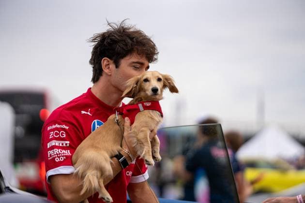 F1 British Grand Prix - UK Charles Leclerc (Mon) of Scuderia Ferrari 16 and Leo Leclerc (Dog) during the Formula 1 Qatar Airways British Grand Prix 2025 on Friday at the Silverstone International Circuit, Silverstone, England, UK on July 4, 2025. Photo by Antoine Lapeyre ABACAPRESS.COM Silverstone England United Kingdom  Copyright: xLapeyrexAntoine ABACAx