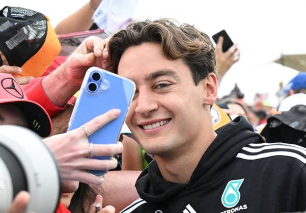 4th July 2025; Silverstone Circuit, Northamptonshire, England; Formula 1 2025 Qatar Airways British F1 Grand Prix; Free Practice Day; George Russell of Mercedes poses for photos with fans on arrival at Silverstone  ActionPlus12808603 SimonxWest