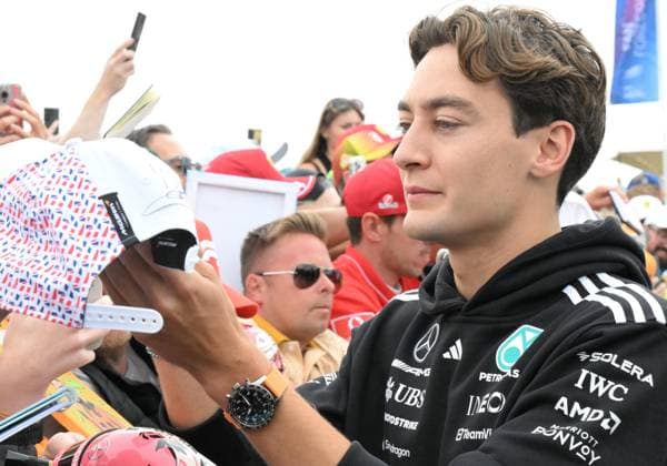 4th July 2025; Silverstone Circuit, Northamptonshire, England; Formula 1 2025 Qatar Airways British F1 Grand Prix; Free Practice Day; George Russell of Mercedes signs autographs on arrival at Silverstone  ActionPlus12808604 SimonxWest