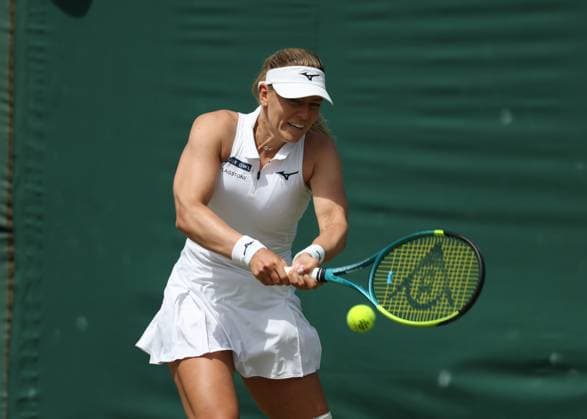 4th July 2025; All England Lawn Tennis and Croquet Club, London, England; Wimbledon Tennis Tournament, Day 5; Amanda Anisimova (USA) with a backhand shot to Dalma Galfi (HUN)  ActionPlus12808750 JohnxPatrickxFletcher
