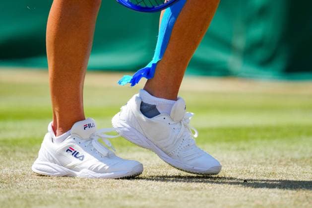 Kinesiology tape coming unstuck on the legs of Laura Siegemund Wimbledon Tennis Championships, Day 5, The All England Lawn Tennis and Croquet Club, London, UK - 04 Jul 2025London The All England Lawn Tennis and United Kingdom  Copyright: xJavierxGarcia Shutterstockx 15384469by