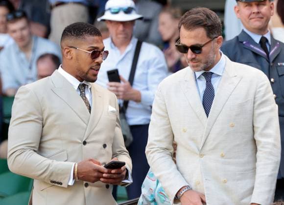 Boxer Antony Joshua and manager Eddie Hearn arrive at the Royal box on day five of the 2025 Wimbledon Championships in London on Friday, June 04, 2025.  LON202507040722 HUGOxPHILPOTT