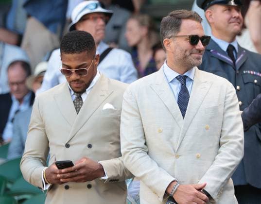 Boxer Antony Joshua and manager Eddie Hearn arrive at the Royal box on day five of the 2025 Wimbledon Championships in London on Friday, June 04, 2025.  LON2025070412 HUGOxPHILPOTT