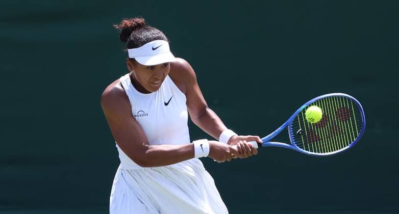 Japan s Naomi Osaka plays a backhand in her third round match against Anastasia Pavlyuchenkova on day five of the 2025 Wimbledon Championships in London on Friday, June 04, 2025.  LON2025070414 HUGOxPHILPOTT