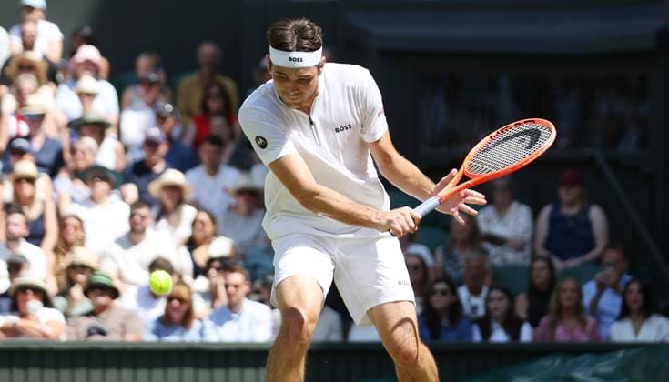 American Taylor Fritz plays a backhand in his third round match against Spain s Alejandro Davidovich Fokina on day five of the 2025 Wimbledon Championships in London on Friday, June 04, 2025.  LON2025070431 HUGOxPHILPOTT