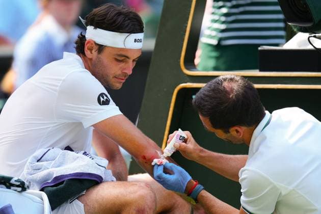 Taylor Fritz receives treatment on a bloodied arm during his third round match Wimbledon Tennis Championships, Day 5, The All England Lawn Tennis and Croquet Club, London, UK - 04 Jul 2025London The All England Lawn Tennis and United Kingdom  Copyright: xJavierxGarcia Shutterstockx 15384469es
