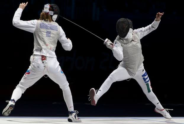 August 2, 2012 - London, England, United Kingdom - Russia s LARISA KOROBEYNIKOVA (right) battles ELISA DI FRANCISCA of Italy during Women s foil team fencing Gold Medal match. Italy went on to take Gold. Copyright: xDanxAndersonx