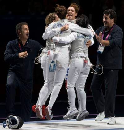 August 2, 2012 - London, England, United Kingdom - Match winner ELISA DI FRANCISCA of Italy celebrates with team and coaches after winning gold in the Women s foil team fencing medal match. Copyright: xDanxAndersonx
