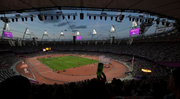 August 3, 2012 - London, England, United Kingdom - Olympic flame burns bright at lower right during athletics competition in the Olympic Stadium. Copyright: xDanxAndersonx