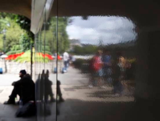 August 3, 2012 - London, England, United Kingdom - A homeless man s reflection is seen on a shiny wall near Olympic Park. Copyright: xDanxAndersonx