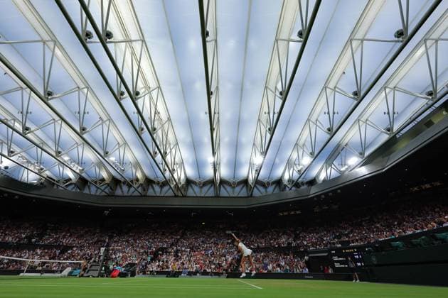 4th July 2025; All England Lawn Tennis and Croquet Club, London, England; Wimbledon Tennis Tournament, Day 5; Aryna Sabalenka (BLR) serves to Emma Raducanu (GBR) inside a closed roof Centre Court  ActionPlus12809194 JohnxPatrickxFletcher