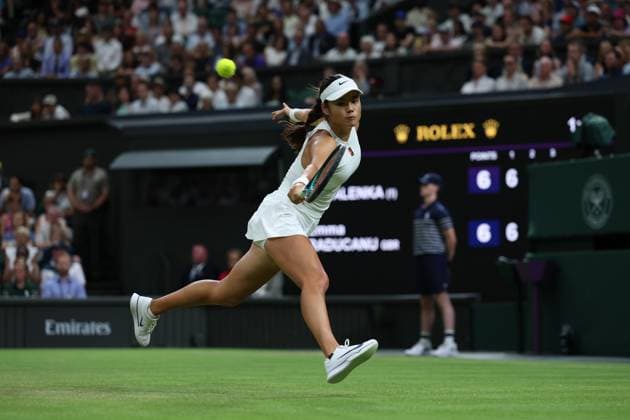 4th July 2025; All England Lawn Tennis and Croquet Club, London, England; Wimbledon Tennis Tournament, Day 5; Emma Raducanu (GBR) with a backhand shot to Aryna Sabalenka (BLR)  ActionPlus12809196 JohnxPatrickxFletcher