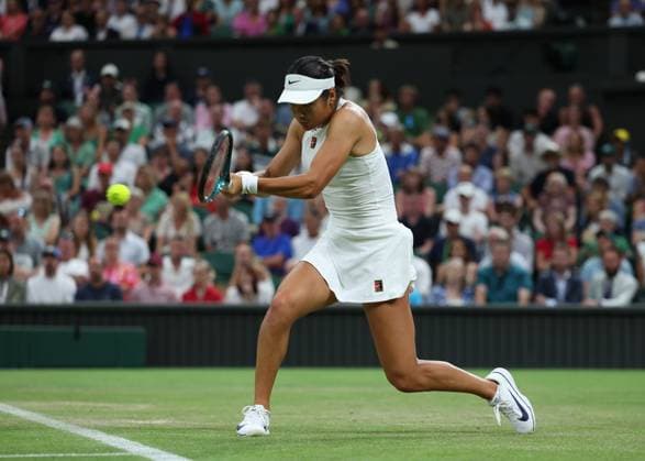 4th July 2025; All England Lawn Tennis and Croquet Club, London, England; Wimbledon Tennis Tournament, Day 5; Emma Raducanu (GBR) with a backhand shot to Aryna Sabalenka (BLR)  ActionPlus12809201 JohnxPatrickxFletcher