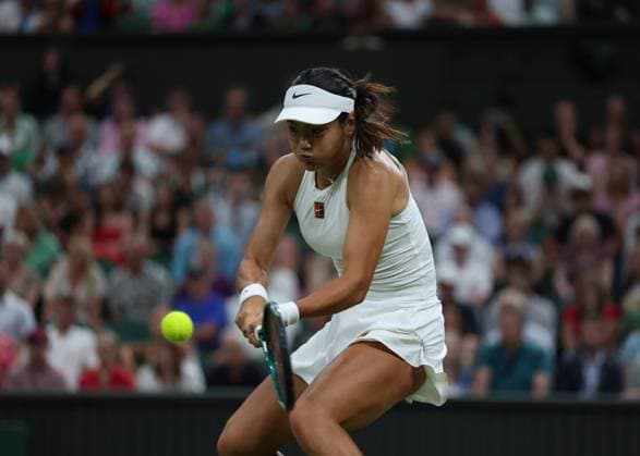 4th July 2025; All England Lawn Tennis and Croquet Club, London, England; Wimbledon Tennis Tournament, Day 5; Emma Raducanu (GBR) with a backhand shot to Aryna Sabalenka (BLR)  ActionPlus12809203 JohnxPatrickxFletcher