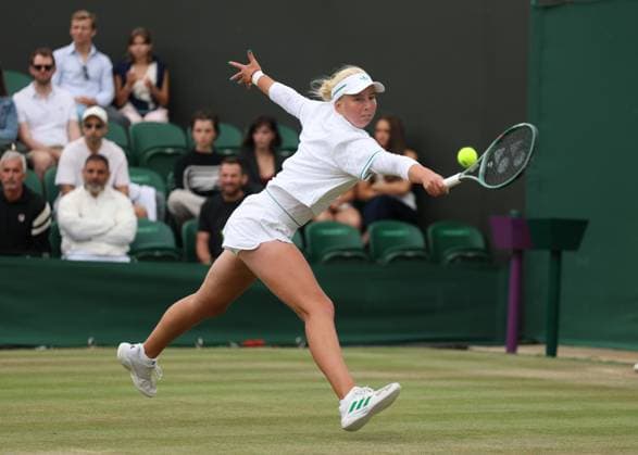 5th July 2025; All England Lawn Tennis and Croquet Club, London, England; Wimbledon Tennis Tournament, Day 6; Clara Tauson (DEN) with a backhand shot to Elena Rybakina (KAZ)  ActionPlus12809303 JohnxPatrickxFletcher