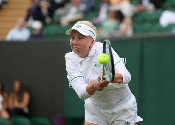 5th July 2025; All England Lawn Tennis and Croquet Club, London, England; Wimbledon Tennis Tournament, Day 6; Clara Tauson (DEN) with a backhand shot to Elena Rybakina (KAZ)  ActionPlus12809304 JohnxPatrickxFletcher