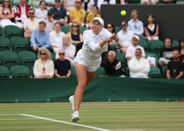 5th July 2025; All England Lawn Tennis and Croquet Club, London, England; Wimbledon Tennis Tournament, Day 6; Clara Tauson (DEN) with a backhand shot to Elena Rybakina (KAZ)  ActionPlus12809305 JohnxPatrickxFletcher