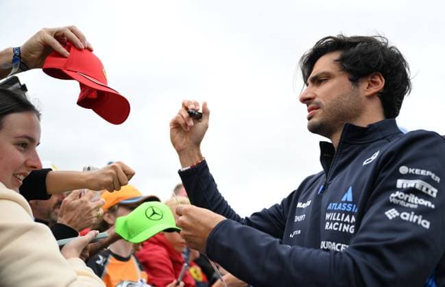 5th July 2025; Silverstone Circuit, Northamptonshire, England; Formula 1 2025 Qatar Airways British F1 Grand Prix; Qualifying Day; Carlos Sainz Jr. of Williams signs autographs on arrival at Silverstone  ActionPlus12809350 SimonxWest