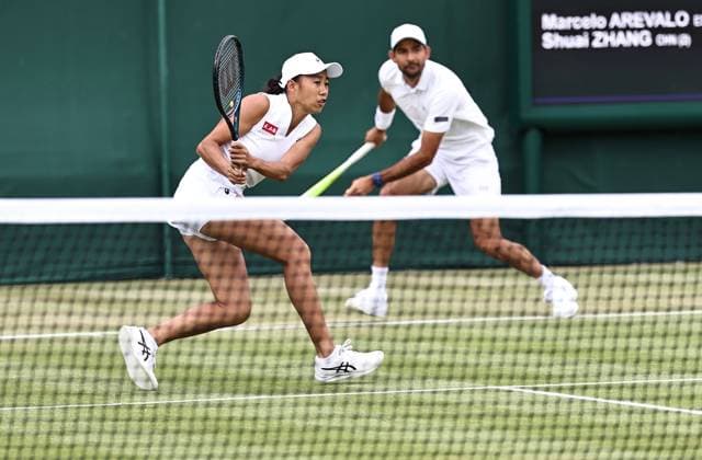 LONDON, ENGLAND - JULY 05: Zhang Shuai of China and Marcelo Arevalo of El Salvador compete against Andre Goransson of Sweden and Chan Hao-Ching of Chinese Taipei during the Mixed Doubles First Round match on day six of 2025 Wimbledon Championships at All England Lawn Tennis and Croquet Club on July 4, 2025 in London, England.  Copyright: xVCGx 111577864308