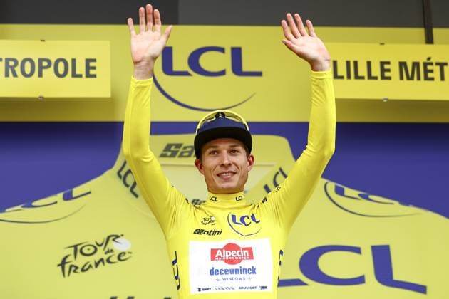 Belgian Jasper Philipsen of Alpecin-Deceuninck celebrates on the podium in the yellow jersey of leader in the overall ranking after the first stage, Lille Metropole to Lille Metropole (185 km), of the 2025 Tour de France cycling race, in Lille, France, on Saturday 05 July 2025. The 112th edition of the Tour de France starts on Saturday 5 July in Lille, France, and will finish in Paris, France on the 27th of July. JASPERxJACOBS  x128489026x