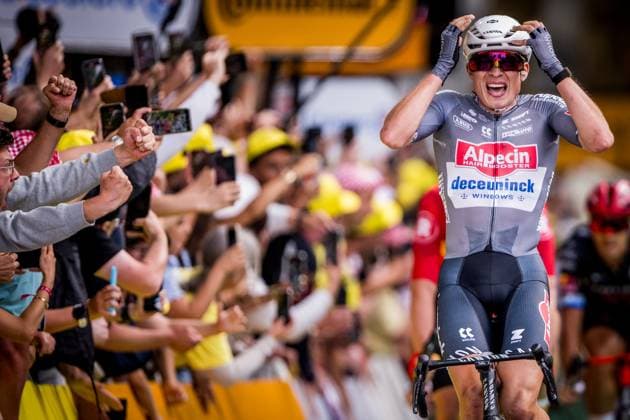 Belgian Jasper Philipsen of Alpecin-Deceuninck celebrates as he crosses the finish line to win the first stage, Lille Metropole to Lille Metropole (185 km), of the 2025 Tour de France cycling race, in Lille, France, on Saturday 05 July 2025. The 112th edition of the Tour de France starts on Saturday 5 July in Lille, France, and will finish in Paris, France on the 27th of July. JASPERxJACOBS  x128504194x