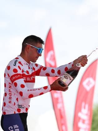 (250706) -- XINING, July 6, 2025 -- Timofei Ivanov of Chengdu DYC Cycling Team celebrates in the polka-dot jersey on the podium after Stage 1 of the Tour of Magnificent Qinghai international Road cycling, Rad, Radsport, Strasse race in Xining, northwest China s Qinghai Province, July 6, 2025. ) (SP)CHINA-QINGHAI-XINING-CYCLING-TOUR OF MAGNIFICENT QINGHAI (CN) ZhangxLong 