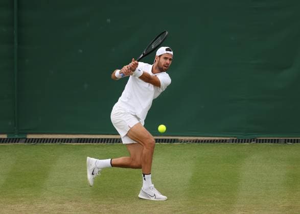 6th July 2025; All England Lawn Tennis and Croquet Club, London, England; Wimbledon Tennis Tournament, Day 7; Karen Khachanov (RUS) with a backhand shot toKamil Majchrzak (POL)  ActionPlus12810491 JohnxPatrickxFletcher