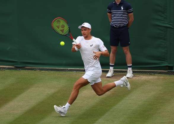6th July 2025; All England Lawn Tennis and Croquet Club, London, England; Wimbledon Tennis Tournament, Day 7; Kamil Majchrzak (POL) with a forehand shot to Karen Khachanov (RUS)  ActionPlus12810500 JohnxPatrickxFletcher