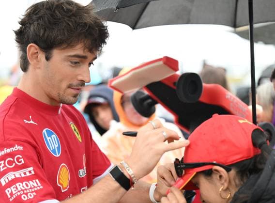 6th July 2025; Silverstone Circuit, Northamptonshire, England; Formula 1 2025 Qatar Airways British F1 Grand Prix; Race Day; Charles Leclerc of Ferrari signs autographs on arrival at Silverstone  ActionPlus12810603 SimonxWest