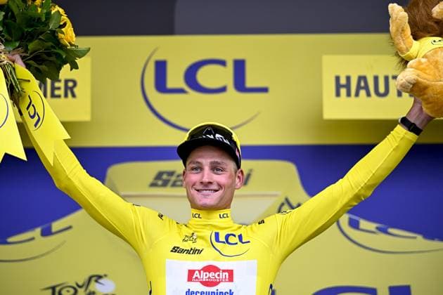 Dutch Mathieu van der Poel of Alpecin-Deceuninck celebrates on the podium in the yellow jersey of leader in the overall ranking after the second stage of the 2025 Tour de France cycling race, from Lauwin-Planque to Boulogne-sur-Mer (212 km), on Sunday 06 July 2025 in France. The 112th edition of the Tour de France starts on Saturday 5 July in Lille, and will finish in Paris on the 27th of July. JASPERxJACOBS  x128549126x