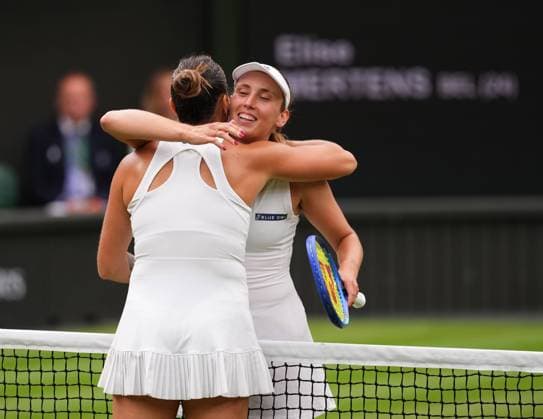 LONDON, ENGLAND - JULY 06: Aryna Sabalenka of Belarus (left) hugs Elise Mertens of Belgium after winning the Ladies Singles fourth round match on day seven of The Championships Wimbledon 2025 at All England Lawn Tennis and Croquet Club on July 06, 2025 in London, England  Copyright: xHiroshixSatox