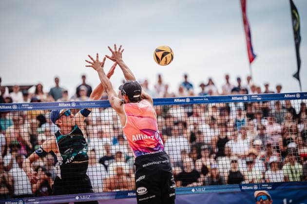 Beach volleyball men Allianz German Beach Tour 2025 Tourstop Munich 06 07 2025 v l Momme Lorenz in attack against Valentin Schneckenburger Munich Central University Sports Munich Bavaria Germany