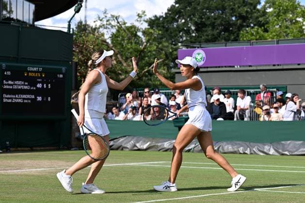 (250707) -- LONDON, July 7, 2025 -- Zhang Shuai (R) Ekaterina Alexandrova react during the women s doubles third round match between Zhang Shuai (China) Ekaterina Alexandrova (Russia) and Hsieh Su-Wei (Chinese Taipei) Jelena Ostapenko (Latvia) at the Wimbledon Tennis Championships in London, Britain, July 6, 2025. ) (SP)BRITAIN-LONDON-TENNIS-WIMBLEDON-WOMEN S DOUBLES ZhaoxDingzhe 