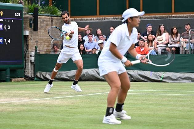 (250707) -- LONDON, July 7, 2025 -- Jiang Xinyu Yuki Bhambri (L) compete during the mixed doubles second round match between Zhang Shuai (China) Marcelo Arevalo (El Salvador) and Jiang Xinyu (China) Yuki Bhambri (India) at the Wimbledon Tennis Championships in London, Britain, July 6, 2025. ) (SP)BRITAIN-LONDON-TENNIS-WIMBLEDON-MIXED DOUBLES ZhaoxDingzhe 