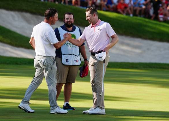 SILVIS, IL - JULY 06: PGA, Golf Herren golfer Brian Thompson is congratulated by Emiliano Grillo after defeating him in a playoff to win the John Deere Classic on July 6, 2025, at TPC Deere Run in Silvis, Illinois. (Photo by Brian Spurlock Icon Sportswire) GOLF: JUL 06 PGA John Deere Classic EDITORIAL USE ONLY Icon25070667