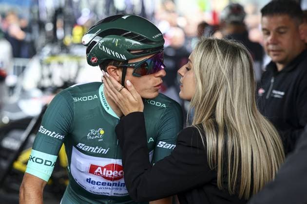 Belgian Jasper Philipsen of Alpecin-Deceuninck and his partner Melanie Peetermans pictured at the start of the third stage of the 2025 Tour de France cycling, from Valenciennes to Dunkerque (178 km) on Monday 07 July 2025 in France. The 112th edition of the Tour de France starts on Saturday 5 July in Lille, France, and will finish in Paris, France on the 27th of July. DAVIDxPINTENS  x128594442x