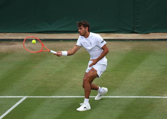 7th July 2025; All England Lawn Tennis and Croquet Club, London, England; Wimbledon Tennis Tournament, Day 8; Flavio Cobolli (ITA) with a forehand shot to Marin Cilic (CRO)  ActionPlus12811163 JohnxPatrickxFletcher